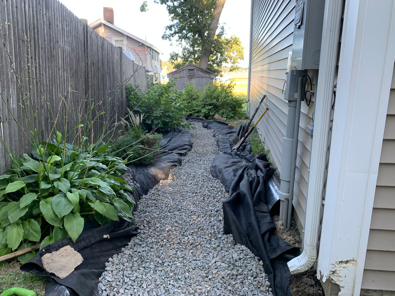 Installation of rock and gravel for walkway